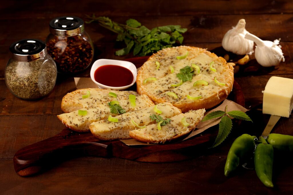 Garlic bread topped with herbs and melted cheese