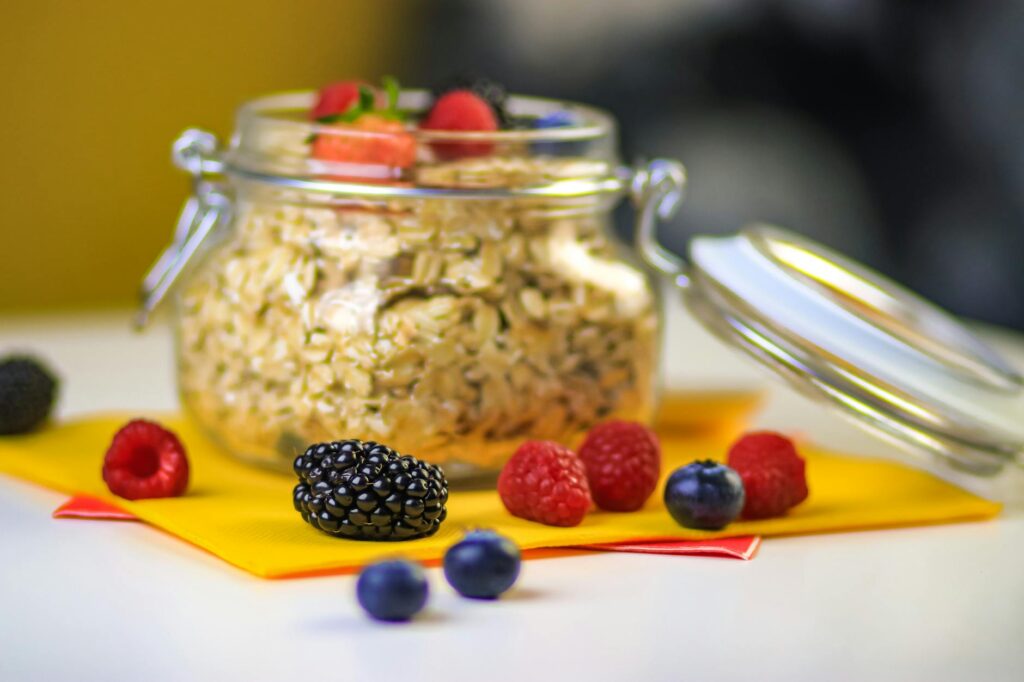 Classic overnight oats in a jar topped with fresh berries